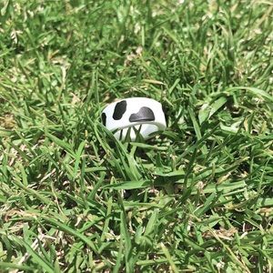 Simple white ring with black cow print.